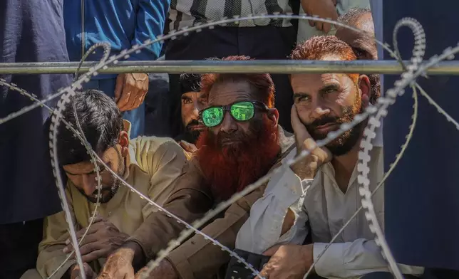 Supporters of Awami Ittehad Party (AIP) leader Sheikh Abdul Rashid attend a public rally at Baramulla some 55 kilometers (34 miles) north of Srinagar, Indian controlled Kashmir, Thursday, Sept. 12, 2024.(AP Photo/Mukhtar Khan)