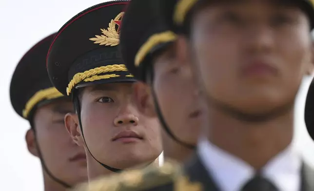 Members of a military honor guard prepare before the arrival of Nigeria's President Bola Ahmed Tinubu at Beijing Capital Airport in Beijing, Sunday, Sept. 1, 2024, ahead of the Forum on China-Africa Cooperation (FOCAC). (Greg Baker/Pool Photo via AP)