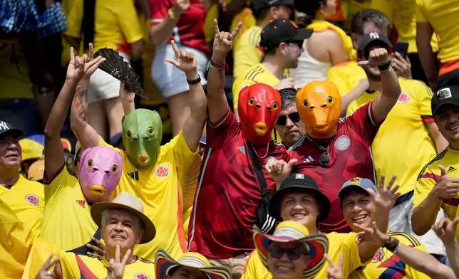 Colombia fans cheer from the stands prior to a qualifying soccer match for the FIFA World Cup 2026 against Argentina at the Metropolitano Roberto Melendez stadium in Barranquilla, Colombia, Tuesday, Sept. 10, 2024. (AP Photo/Fernando Vergara)