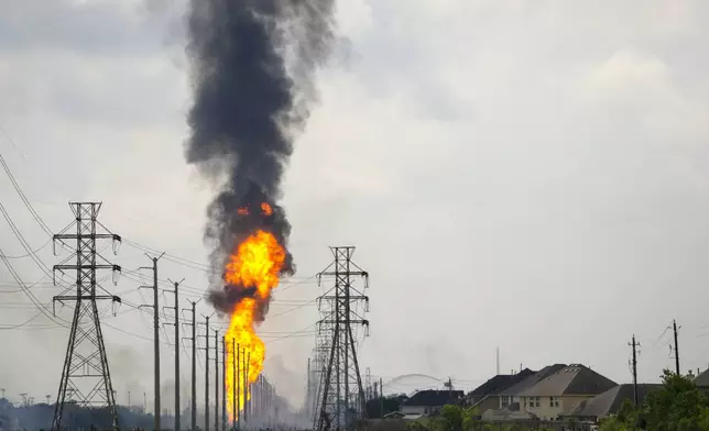 A pipeline with a giant plume of fire burns Monday, Sept. 16, 2024, in La Porte, Texas. (Brett Coomer/Houston Chronicle via AP)