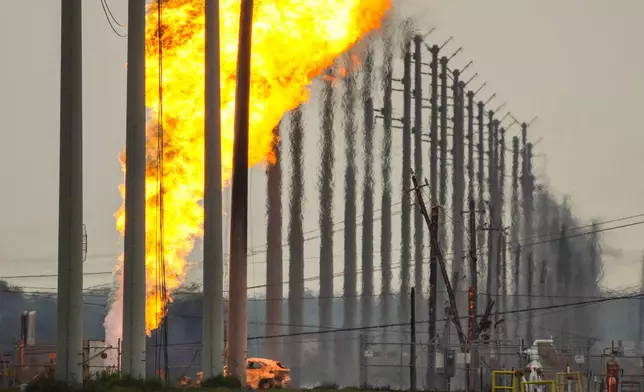 A pipeline carrying liquified natural gas burns near Spencer Highway and Summerton on Monday, Sept. 16, 2024, in La Porte, Texas. (Brett Coomer/Houston Chronicle via AP)