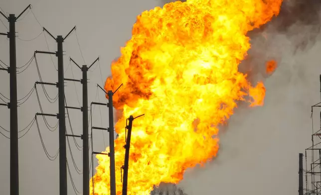 A pipeline carrying liquified natural gas burns near Spencer Highway and Summerton on Monday, Sept. 16, 2024, in La Porte, Texas. (Brett Coomer/Houston Chronicle via AP)