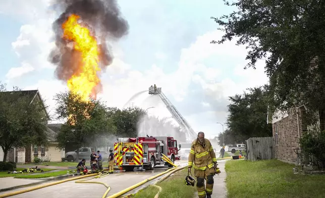 Firefighters battle a blaze from a pipeline carrying liquified natural gas that burns near Spencer Highway and Summerton on Monday, Sept. 16, 2024, in La Porte, Texas. (Brett Coomer/Houston Chronicle via AP)