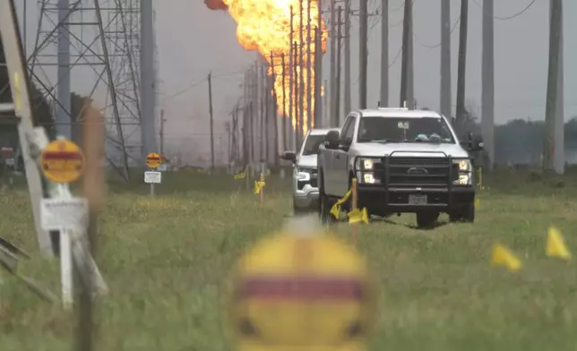 A pipeline carrying natural gas liquids burns in a massive fire near La Porte, Texas, on Monday, Sept. 16, 2024. (AP Photo/Lekan Oyekanmi)