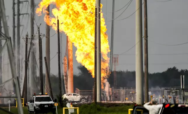 A massive pipeline fire burns near Spencer Highway and Summerton on Monday, Sept. 16, 2024, in La Porte, Texas. (Brett Coomer/Houston Chronicle via AP)