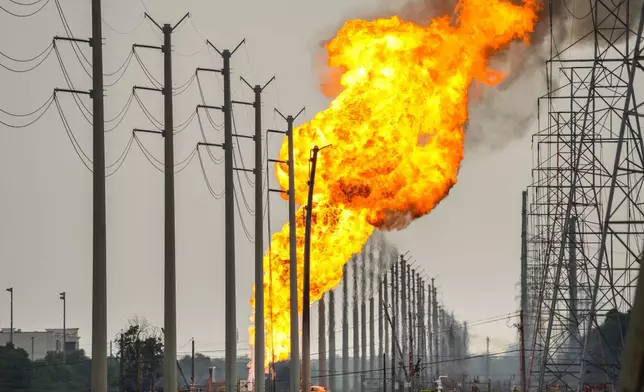 A pipeline carrying liquified natural gas burns near Spencer Highway and Summerton on Monday, Sept. 16, 2024, in La Porte, Texas. (Brett Coomer/Houston Chronicle via AP)