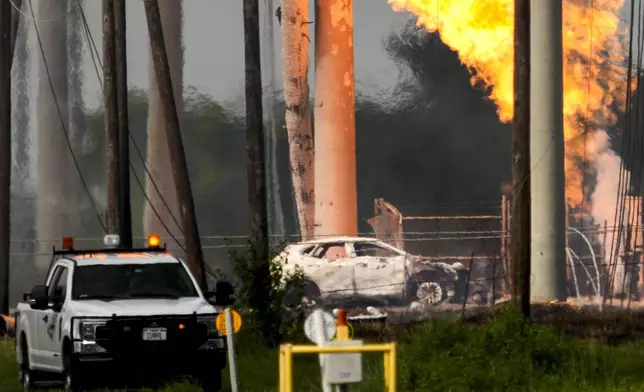 FILE - A massive pipeline fire burns after a vehicle drove through a fence along a parking lot and struck an above-ground valve near Spencer Highway and Summerton on Monday, Sept. 16, 2024, in La Porte, Texas. (Brett Coomer/Houston Chronicle via AP)