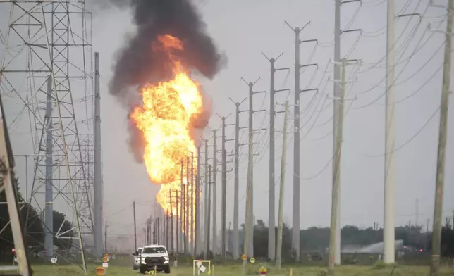 A pipeline carrying natural gas liquids burns near La Porte, Texas, on Monday, Sept. 16, 2024. (AP Photo/Lekan Oyekanmi)