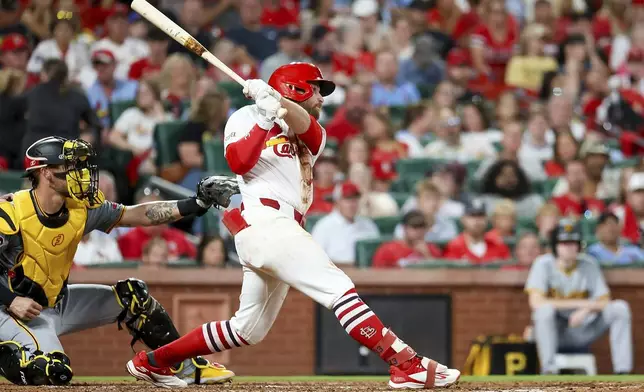 St. Louis Cardinals' Brendan Donovan hits an RBI double during the sixth inning of a baseball game against the Pittsburgh Pirates, Thursday, Sept. 19, 2024, in St. Louis. (AP Photo/Scott Kane)