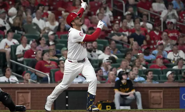 St. Louis Cardinals' Nolan Arenado hits a sacrifice fly to score Masyn Winn during the eighth inning of a baseball game against the Pittsburgh Pirates Tuesday, Sept. 17, 2024, in St. Louis. (AP Photo/Jeff Roberson)