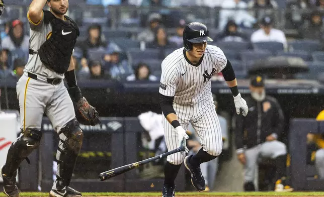 New York Yankees Ben Rice, right, runs to first base after hitting a fly out during the third inning of a baseball game against the Pittsburgh Pirates, Sunday, Sept. 29, 2024, in New York. (AP Photo/Eduardo Munoz Alvarez)