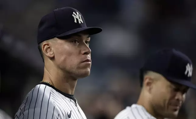 New York Yankees' Aaron Judge looks on from the dugout during the ninth inning of a baseball game against the Pittsburgh Pirates, Friday, Sept. 27, 2024, in New York. (AP Photo/Adam Hunger)