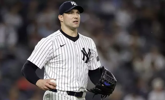 New York Yankees relief pitcher Tommy Kahnle reacts after giving up a two-run home run to Pittsburgh Pirates' Bryan Reynolds during the eighth inning of a baseball game Friday, Sept. 27, 2024, in New York. (AP Photo/Adam Hunger)