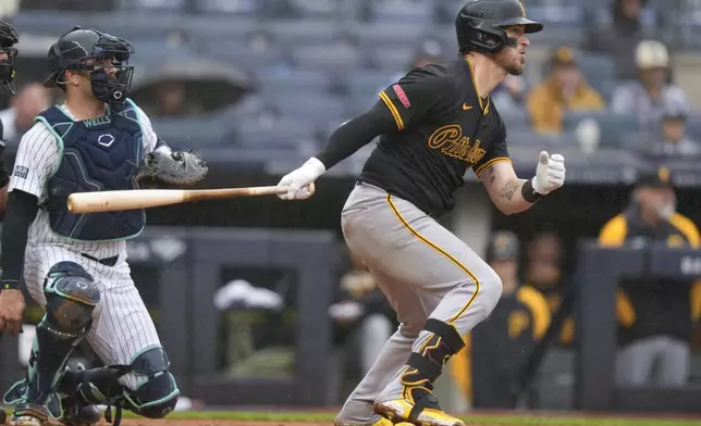 New York Yankees catcher Austin Wells watches as Pittsburgh Pirates' Yasmani Grandal hits an RBI single during the ninth inning of a baseball game, Saturday, Sept. 28, 2024, in New York. (AP Photo/Frank Franklin II)