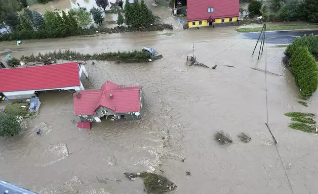 This handout photo provided by the Polish fire department, shows a flooded area near the Nysa Klodzka river in Nysa, Poland on Monday, Sept. 16, 2024. (KG PSP Photo via AP)