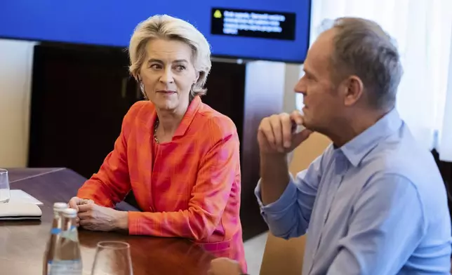 European Commmission President Ursula von der Leyen, left, meets with Poland's Prime Minister Donald Tusk, at the town hall in Woclaw, Poland, Thursday, Sept. 19, 2024. (Christoph Soeder/DPA via AP, Pool)