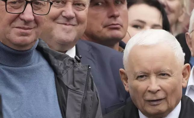 Leader of Poland's right-wing opposition party Law and Justice, Jaroslaw Kaczynski, right, attends the party's protest rally of a few thousand backers against the policies of Prime Minister Donald Tusk's Cabinet before the Ministry of Justice, in Warsaw, Poland, Saturday Sept. 14, 2024. (AP Photo/Czarek Sokolowski)