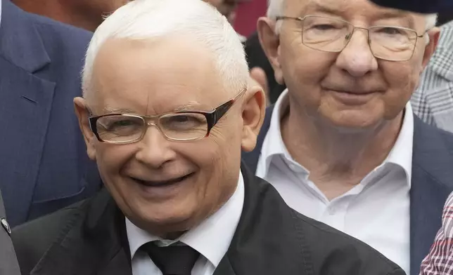 Leader of Poland's right-wing opposition party Law and Justice, Jaroslaw Kaczynski, left, attends the party's protest rally of a few thousand backers against the policies of Prime Minister Donald Tusk's Cabinet, before the Ministry of Justice, in Warsaw, Poland, Saturday Sept. 14, 2024. (AP Photo/Czarek Sokolowski)