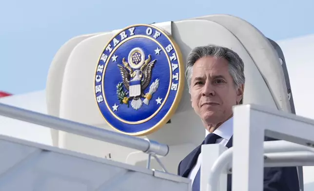 U.S. Secretary of State, Antony Blinken waves as he arrives at Chopin Airport in Warsaw, Poland, Thursday, Sept. 12, 2024. (AP Photo/Mark Schiefelbein, Pool)