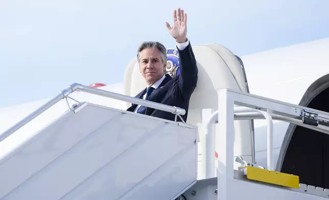 U.S. Secretary of State, Antony Blinken waves as he arrives at Chopin Airport in Warsaw, Poland, Thursday, Sept. 12, 2024. (AP Photo/Mark Schiefelbein, Pool)