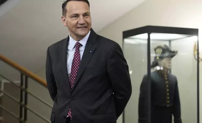 Polish Foreign Minister Radosław Sikorski waits for the arrival of U.S. Secretary of State, Antony Blinken for a talks in Warsaw, Poland, Thursday, Sept. 12, 2024. (AP Photo/Czarek Sokolowski)