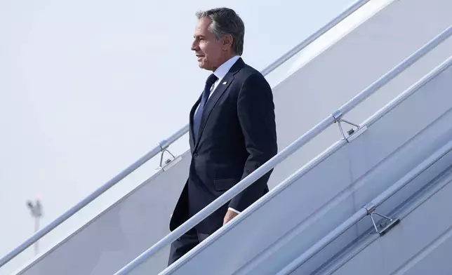 U.S. Secretary of State, Antony Blinken waves as he arrives at Chopin Airport in Warsaw, Poland, Thursday, Sept. 12, 2024. (AP Photo/Mark Schiefelbein, Pool)