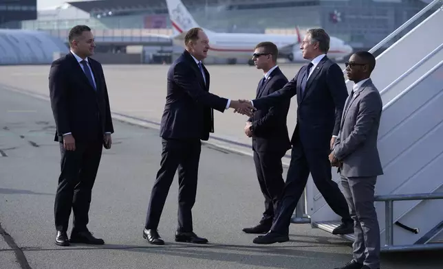 U.S. Secretary of State, Antony Blinken, second from right, welcomes by Ambassador of the United States to Poland Mark Brzezinski, second from left, as he arrives at Chopin Airport in Warsaw, Poland, Thursday, Sept. 12, 2024. (AP Photo/Mark Schiefelbein, Pool)