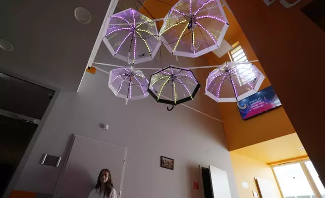 A Polish student walks in the hall of a school attended by Ukrainian students on the first day of school in the No. 361 school in Warsaw, Poland, Monday Sept. 2, 2024. (AP Photo/Czarek Sokolowski)