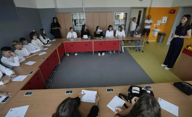 Students attend a special session for Ukrainians to learn the Polish language, during the first day of school in Warsaw, Poland, Monday Sept. 2, 2024. (AP Photo/Czarek Sokolowski)