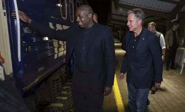 British Foreign Secretary David Lammy, left, and U.S. Secretary of State Antony Blinken board a train at Przemysl train station in Poland Wednesday, Sept. 11, 2024 as they prepare to travel to Ukraine. (Leon Neal/Pool Photo via AP)