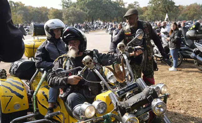 Motorcyclists arrive at the parking lots around the Roman Catholic holy shrine of Fatima to attend the IX Pilgrimage of the Blessing of Helmets that draws tens of thousands, in Fatima, Portugal, Sunday, Sept. 22, 2024. (AP Photo/Ana Brigida)