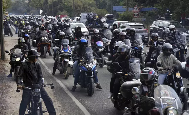 Thousands of motorcyclists leave after attending the IX Pilgrimage of the Blessing of Helmets at the Roman Catholic holy shrine of Fatima, in Fatima, Portugal, Sunday, Sept. 22, 2024. (AP Photo/Ana Brigida)