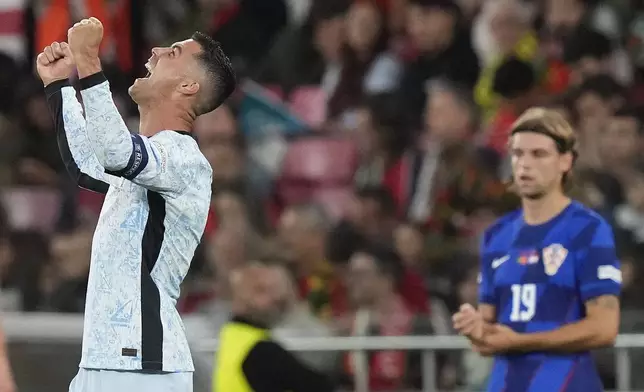 Portugal's Cristiano Ronaldo celebrates after scoring his side's second goal during the UEFA Nations League soccer match between Portugal and Croatia at the Luz stadium in Lisbon, Thursday, Sept. 5, 2024. (AP Photo/Armando Franca)