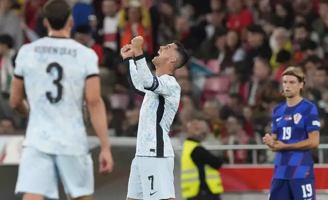 Portugal's Cristiano Ronaldo celebrates after scoring his side's second goal during the UEFA Nations League soccer match between Portugal and Croatia at the Luz stadium in Lisbon, Thursday, Sept. 5, 2024. (AP Photo/Armando Franca)