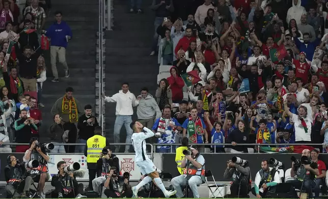 Portugal's Cristiano Ronaldo celebrates after scoring his side's second goal during the UEFA Nations League soccer match between Portugal and Croatia at the Luz stadium in Lisbon, Thursday, Sept. 5, 2024. (AP Photo/Armando Franca)