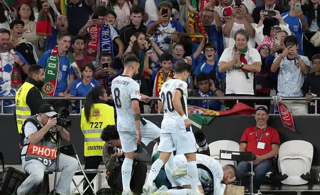 Portugal's Cristiano Ronaldo, right, celebrates after scoring his side's second goal during the UEFA Nations League soccer match between Portugal and Croatia at the Luz stadium in Lisbon, Thursday, Sept. 5, 2024. (AP Photo/Armando Franca)