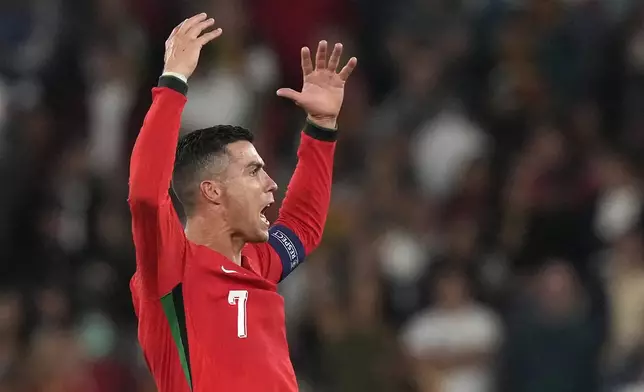 Portugal's Cristiano Ronaldo celebrates after the UEFA Nations League soccer match between Portugal and Scotland at the Luz stadium in Lisbon, Portugal, Sunday, Sept. 8, 2024. (AP Photo/Armando Franca)