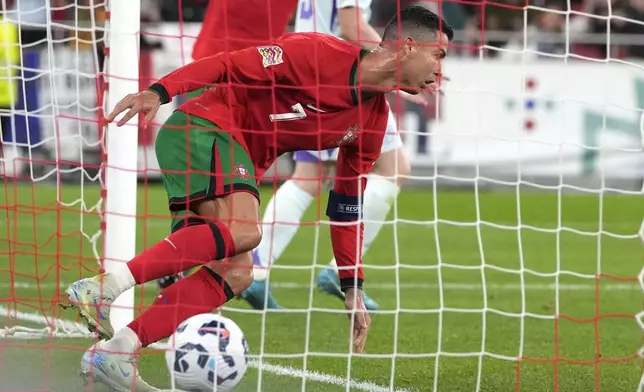 Portugal's Cristiano Ronaldo celebrates after scoring his side's second goal during the UEFA Nations League soccer match between Portugal and Scotland at the Luz stadium in Lisbon, Portugal, Sunday, Sept. 8, 2024. (AP Photo/Armando Franca)