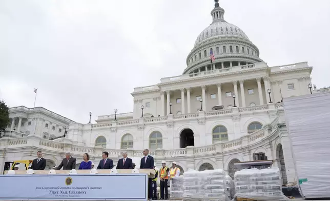 Congress members hammer in the first nails at the First Nail Ceremony marking the beginning of construction of the 2025 Presidential Inauguration platform on the steps of the Capitol, Wednesday, Sept. 18, 2024, in Washington. (AP Photo/Mariam Zuhaib)