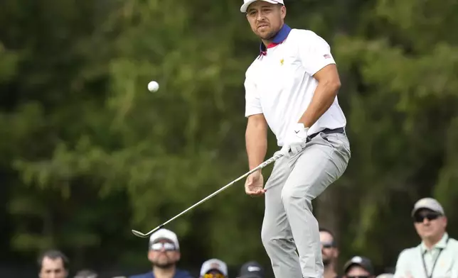 United States team member Xander Schauffele chips onto the second green during the second round of the Presidents Cup golf tournament at Royal Montreal Golf Club in Montreal, Friday, Sept. 27, 2024. (Frank Gunn/The Canadian Press via AP)