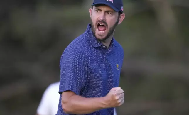 United States team member Patrick Cantlay reacts after making the winning putt on the 18th hole during their fourth round foursomes match at the Presidents Cup golf tournament at Royal Montreal Golf Club Saturday, Sept. 28, 2024 in Montreal. (Frank Gunn/The Canadian Press via AP)