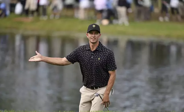 International team member Adam Scott, of Australia, reacts to his shot out of the bunker on the 16th hole during a first round four-ball match at the Presidents Cup golf tournament at the Royal Montreal Golf Club in Montreal, Thursday, Sept. 26, 2024. (Graham Hughes/The Canadian Press via AP)