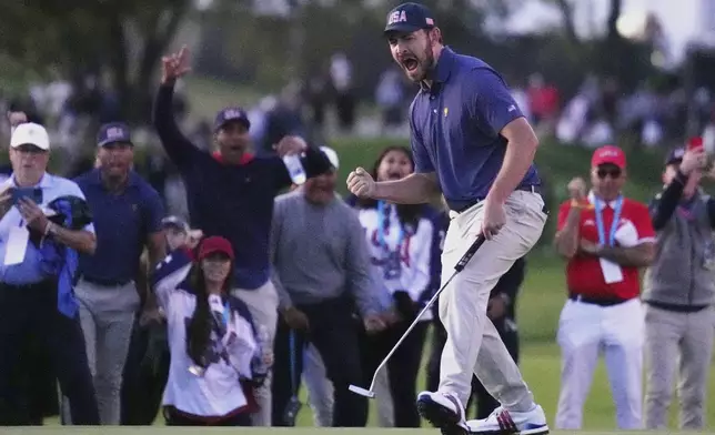 United States team member Patrick Cantlay reacts after making the winning putt on the 18th hole during their fourth round foursomes match at the Presidents Cup golf tournament at Royal Montreal Golf Club Saturday, Sept. 28, 2024 in Montreal. (Nathan Denette/The Canadian Press via AP)