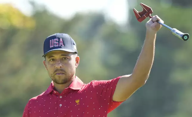 United States team member Xander Schauffele reacts after making a birdie on the first hole during their fifth round singles match at the Presidents Cup golf tournament at Royal Montreal Golf Club on Sunday, Sept. 29, 2024, in Montreal. (Frank Gunn/The Canadian Press via AP)