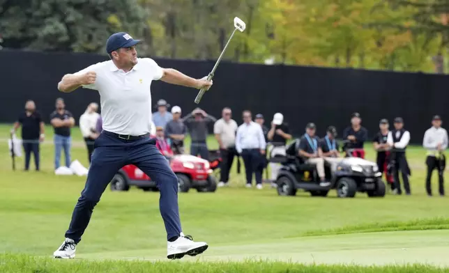 United States team member Keegan Bradley reacts after a long putt on the 13th green during a first-round four-ball match at the Presidents Cup golf tournament at the Royal Montreal Golf Club in Montreal, Thursday, Sept. 26, 2024. (Nathan Denette/The Canadian Press via AP)