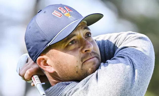 United States team member Xander Schauffele tees off on the third hole during a practice round at the Presidents Cup golf tournament at Royal Montreal Golf Club in Montreal, Tuesday, Sept. 24, 2024. (Graham Hughes/The Canadian Press via AP)