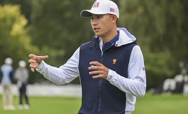 United States team member Collin Morikawa gestures on the putting green during practice at the Presidents Cup at Royal Montreal Golf Club on Monday, Sept. 23, 2024, in Montreal. (Graham Hughes/The Canadian Press via AP)