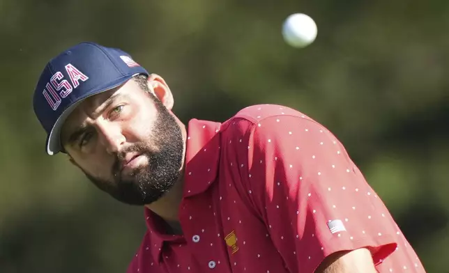 United States team member Scottie Scheffler chips onto the 5th green during their fifth round singles match at the Presidents Cup golf tournament at Royal Montreal Golf Club on Sunday, Sept. 29, 2024, in Montreal. (Frank Gunn/The Canadian Press via AP)