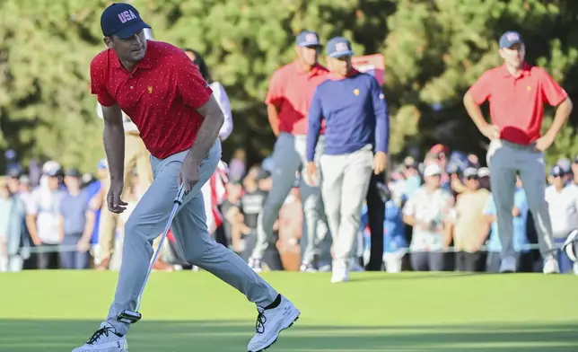 United States team member Keegan Bradley reacts after a putt on the 18th green during a fifth-round singles match at the Presidents Cup golf tournament at Royal Montreal Golf Club, Sunday, Sept. 29, 2024, in Montreal. (Graham Hughes/The Canadian Press via AP)