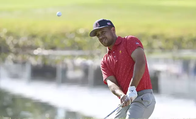 United States team member Xander Schauffele hits onto the 15th green during a fifth-round singles match at the Presidents Cup golf tournament at Royal Montreal Golf Club, Sunday, Sept. 29, 2024, in Montreal. (Graham Hughes/The Canadian Press via AP)